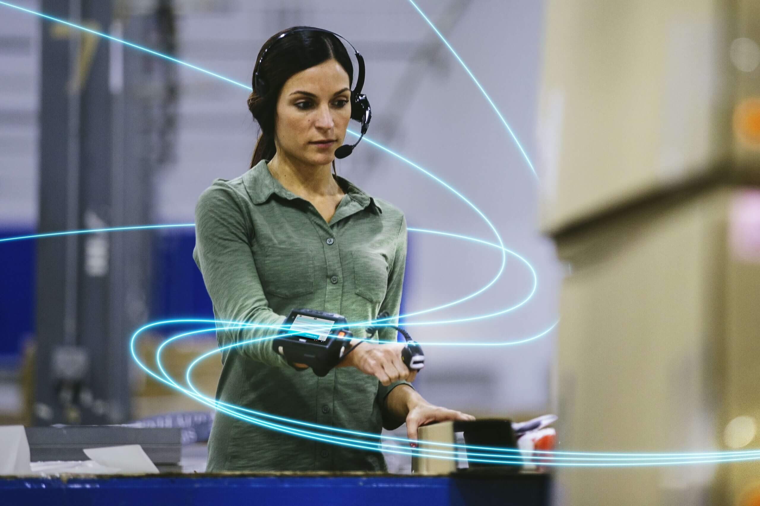 woman using scanner in warehouse for inventory