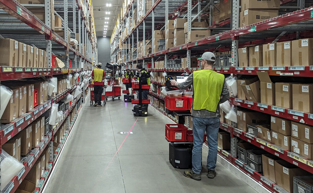 woman using scanner in warehouse for inventory